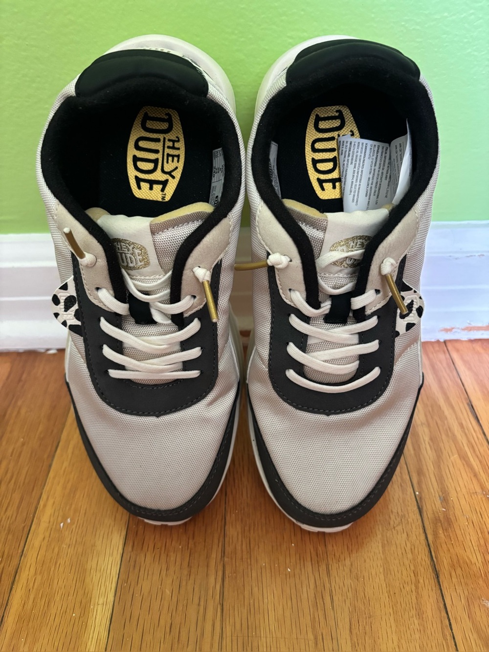 Hey Dude Cream and Black Low-Top Sneakers